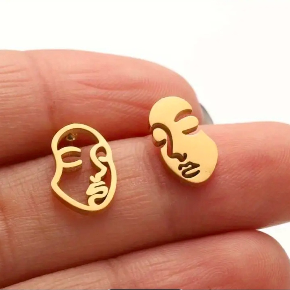 Abstract gold faces stud earrings